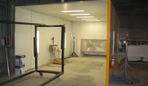 Enclosed work area for sand blasting